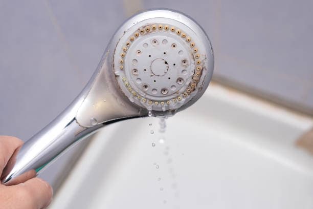 Mineral scale buildup on a water heater element from GTA hard water