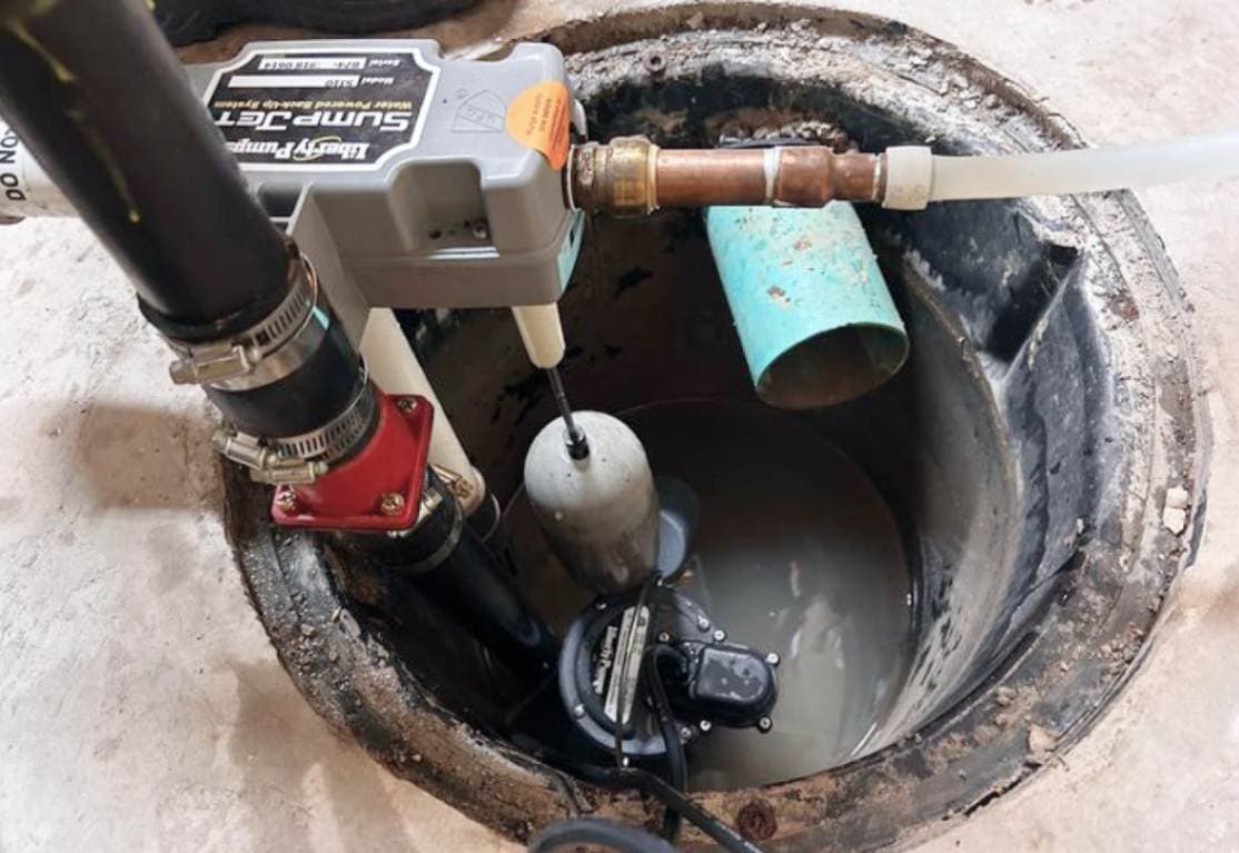 Sump pit and pump installed in a Niagara Falls basement